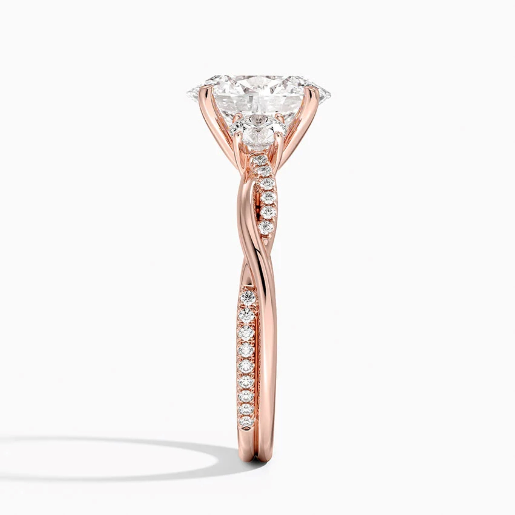 Twist Oval Diamond Three Stone Engagement Ring