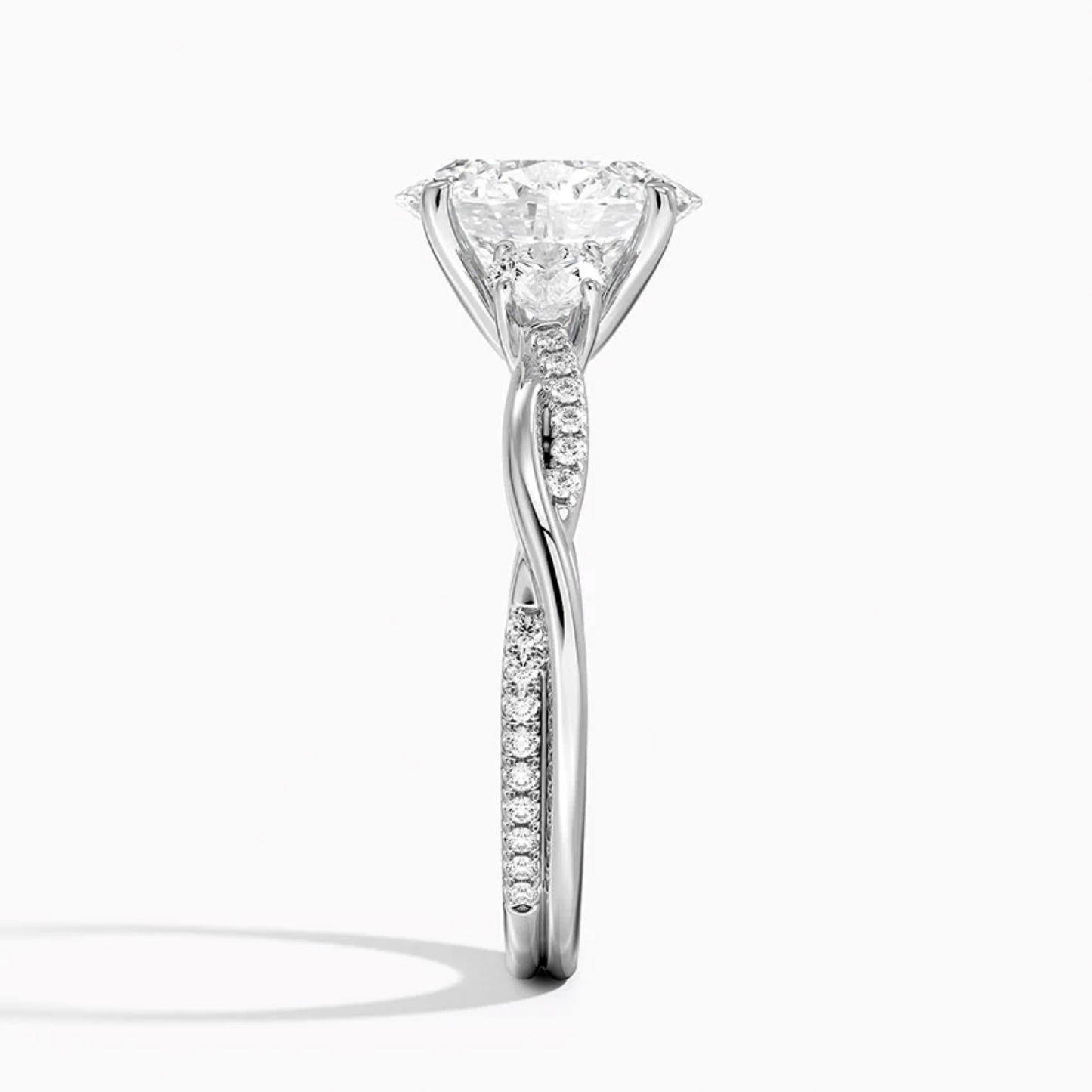 Twist Oval Diamond Three Stone Engagement Ring